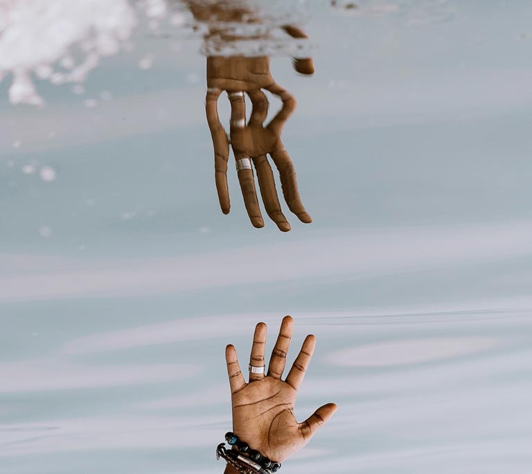 The Symbolic Life. reflected-hand